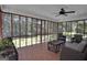 Relaxing screened porch with wicker furniture and access to the backyard at 4505 Cochran Mill Rd, Fairburn, GA 30213