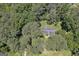 House nestled in a wooded area, offering privacy at 4505 Cochran Mill Rd, Fairburn, GA 30213