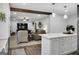Open concept kitchen overlooking living area, featuring island and breakfast bar at 4505 Cochran Mill Rd, Fairburn, GA 30213