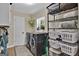 Laundry room with washer, dryer, and ample storage at 4505 Cochran Mill Rd, Fairburn, GA 30213