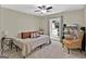Bright bedroom with a comfortable bed, window, and an armchair at 4505 Cochran Mill Rd, Fairburn, GA 30213