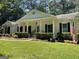 White brick ranch home with front porch and landscaping at 4505 Cochran Mill Rd, Fairburn, GA 30213