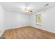 Bright bedroom featuring wood flooring and a ceiling fan at 370 Oak St, Fayetteville, GA 30215