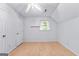 Simple bedroom with wood flooring and double closets at 370 Oak St, Fayetteville, GA 30215