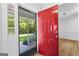 Inviting entryway with a red front door and view of the living area at 370 Oak St, Fayetteville, GA 30215