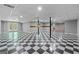 Finished basement with a checkerboard floor and large space at 30 Allie Dr, Mcdonough, GA 30252
