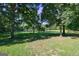 Expansive pond view from a grassy area with trees at 3655 Highway 81 W, Hampton, GA 30228