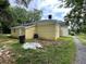 Rear view of house with yellow siding at 36 Railroad St, Kingston, GA 30145