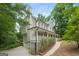 Two-story home with wrap-around porch and attached garage at 267 Wellington Walk, Douglasville, GA 30134