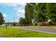 Roadside view of property with a treeline and road at 1042 Harbins Rd, Dacula, GA 30019