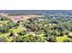 Aerial view highlighting the property's location near commercial development at 1042 Harbins Rd, Dacula, GA 30019