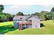 Two story home with deck and stairs leading to backyard at 1042 Harbins Rd, Dacula, GA 30019