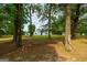 Ranch style home nestled on a spacious lot with mature trees at 1042 Harbins Rd, Dacula, GA 30019