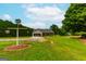 Front view of house with a large yard at 1042 Harbins Rd, Dacula, GA 30019
