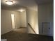 Upstairs hallway with access to bedrooms and bathroom at 105 Creekside Knl, Grantville, GA 30220