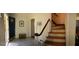 Entryway with tiled floor and staircase leading upstairs at 2692 Peppermint Dr, Tucker, GA 30084