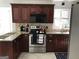 Updated kitchen with granite countertops and stainless steel appliances at 2692 Peppermint Dr, Tucker, GA 30084