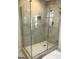 Large walk-in shower with glass enclosure and marble tile at 2692 Peppermint Dr, Tucker, GA 30084