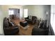 Living room with hardwood floors and comfortable leather furniture at 2692 Peppermint Dr, Tucker, GA 30084