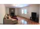 Gathering room with hardwood floors, fireplace, and French doors at 2692 Peppermint Dr, Tucker, GA 30084