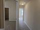 Carpeted hallway with access to bedrooms and closets at 5700 Laney Dr, Rex, GA 30273