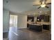 Open concept living room with kitchen and hardwood floors at 5700 Laney Dr, Rex, GA 30273