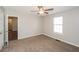 Spacious bedroom with window and door to hallway at 10 Lady Morgan Ln, Dallas, GA 30157