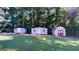 Three sheds in a wooded backyard setting at 5110 Macland Rd, Powder Springs, GA 30127