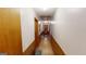 Long hallway with wood paneling and wood floors at 5110 Macland Rd, Powder Springs, GA 30127