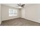 Spacious bedroom with ceiling fan and neutral carpeting at 281 Silver Ridge Dr, Dallas, GA 30157