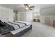 Spacious primary bedroom with ample natural light and carpeted floors at 100 Belgian Ct, Hampton, GA 30228