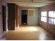 Spacious living room with hardwood floors and brick fireplace at 960 Stone Mountain Lithonia Rd, Lithonia, GA 30058