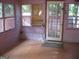Sunroom with multiple windows and access to a deck at 960 Stone Mountain Lithonia Rd, Lithonia, GA 30058