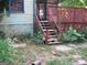 Backyard with wooden steps leading to a deck at 960 Stone Mountain Lithonia Rd, Lithonia, GA 30058
