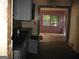 Kitchen with grey cabinets and view into adjacent room at 960 Stone Mountain Lithonia Rd, Lithonia, GA 30058