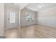 Bright entryway with neutral color scheme and wood-look floors at 659 Stately Dr, Woodstock, GA 30188