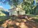 Small outbuilding with metal roof and trailer at 433 Mount Moriah Rd, Auburn, GA 30011