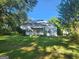 White ranch home with a spacious yard at 433 Mount Moriah Rd, Auburn, GA 30011
