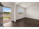 Spacious office with dark hardwood floors and a view of the backyard at 607 Whitman Lane # 203, Stockbridge, GA 30281