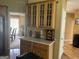 Kitchen features ample cabinetry and glass-front cabinets at 1221 Rhodes Sw Walk, Conyers, GA 30094