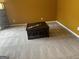 Spacious living room with large coffee table and neutral wall color at 1221 Rhodes Sw Walk, Conyers, GA 30094