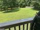 Large grassy backyard with wooden privacy fence at 1221 Rhodes Sw Walk, Conyers, GA 30094