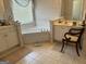 Spacious bathroom with corner bathtub, double vanity, and tiled floor at 1221 Rhodes Sw Walk, Conyers, GA 30094