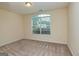 Bright bedroom featuring a large window and carpet at 153 Fears Dr, Hampton, GA 30228