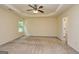 Well-lit bedroom with ceiling fan and neutral wall tones at 153 Fears Dr, Hampton, GA 30228