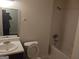 Bathroom with tub, toilet, and vanity at 7396 Meadows Dr, Riverdale, GA 30274