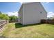 Large backyard with grassy lawn and wooden fence at 6904 Oak Valley Dr, Douglasville, GA 30134