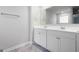 Modern bathroom with double vanity and large mirror at 6904 Oak Valley Dr, Douglasville, GA 30134