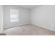 Bright bedroom with neutral walls and carpeting at 6904 Oak Valley Dr, Douglasville, GA 30134