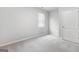 Bright bedroom with neutral walls and carpet flooring at 6904 Oak Valley Dr, Douglasville, GA 30134